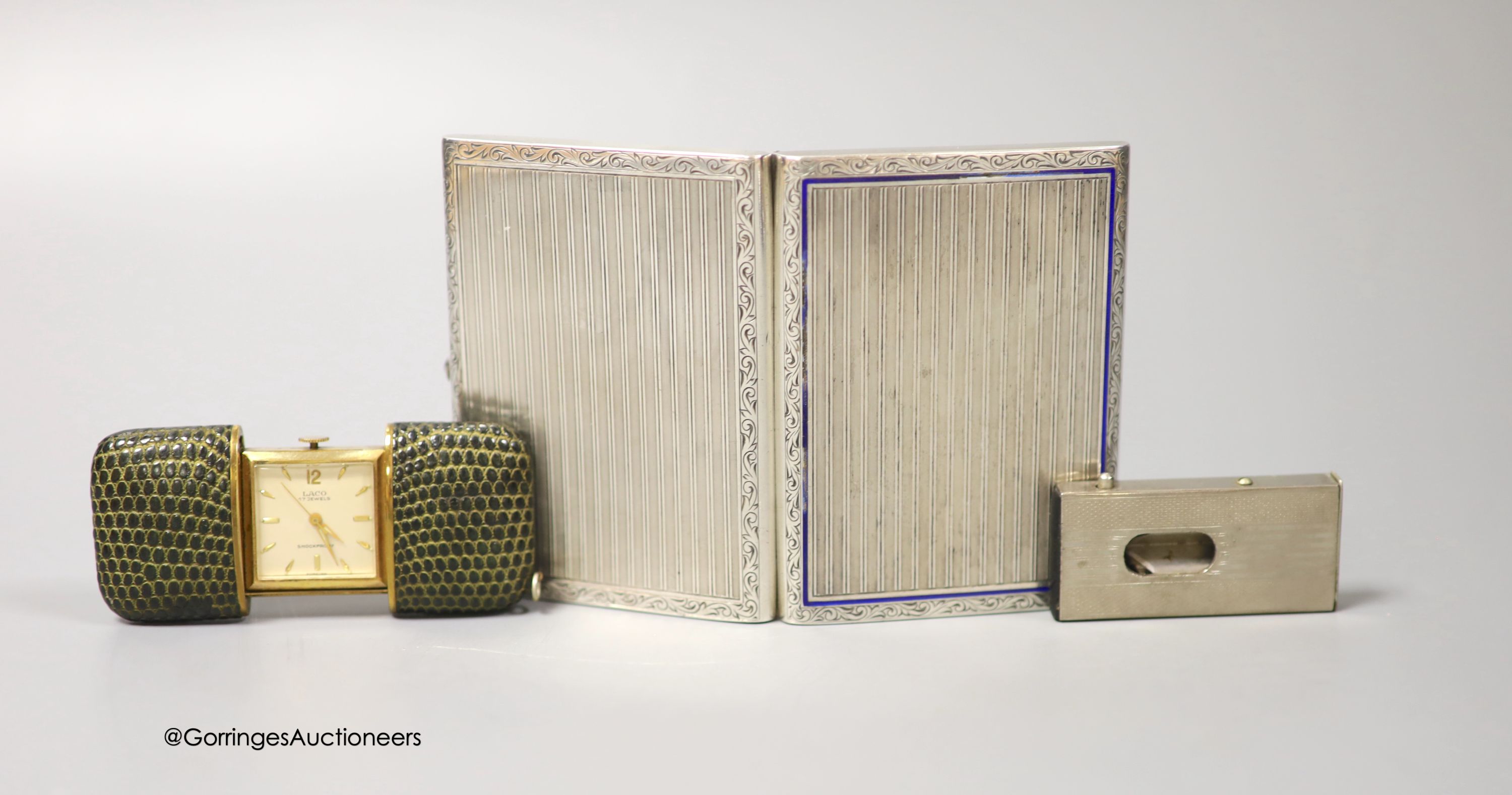 A German 935 white metal and enamel cigarette case, with interior inscription, 'In gratitude For Your Sincere Friendship, The Jewish Community, Luneberg, January, 1948', 87mm, together with a base metal cigar cutter and